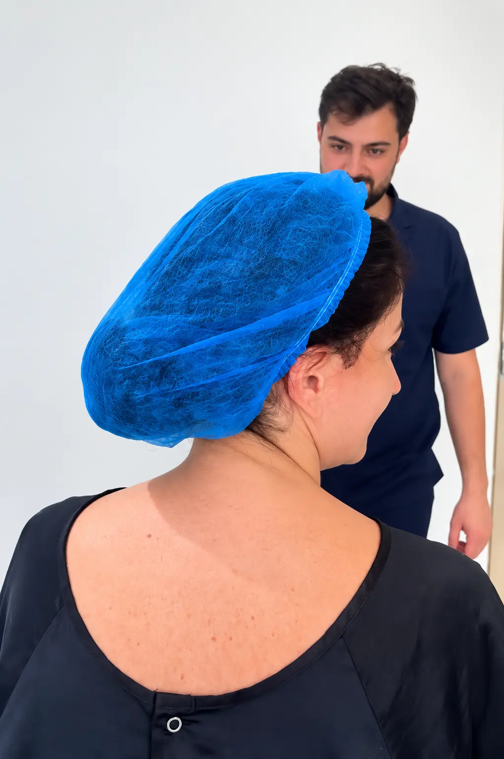 Female patient prepared for hair restoration treatment at a clinic